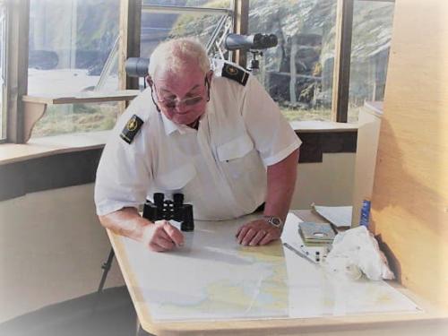 Graham Perry overlooking some maps